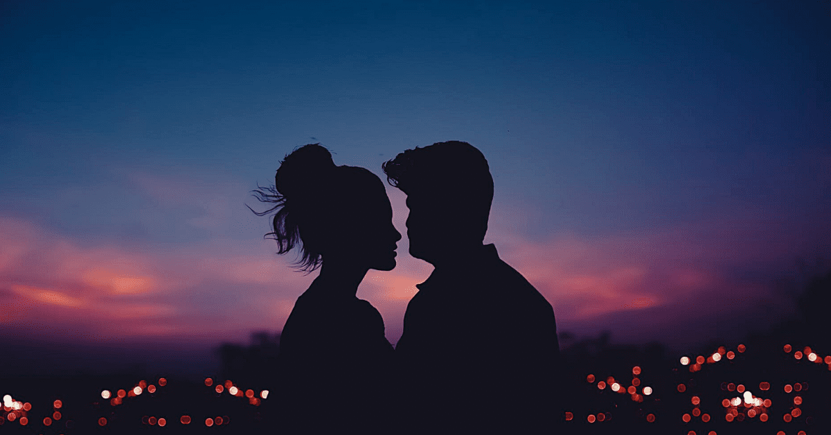 couple, in love, standing together as the sun sets